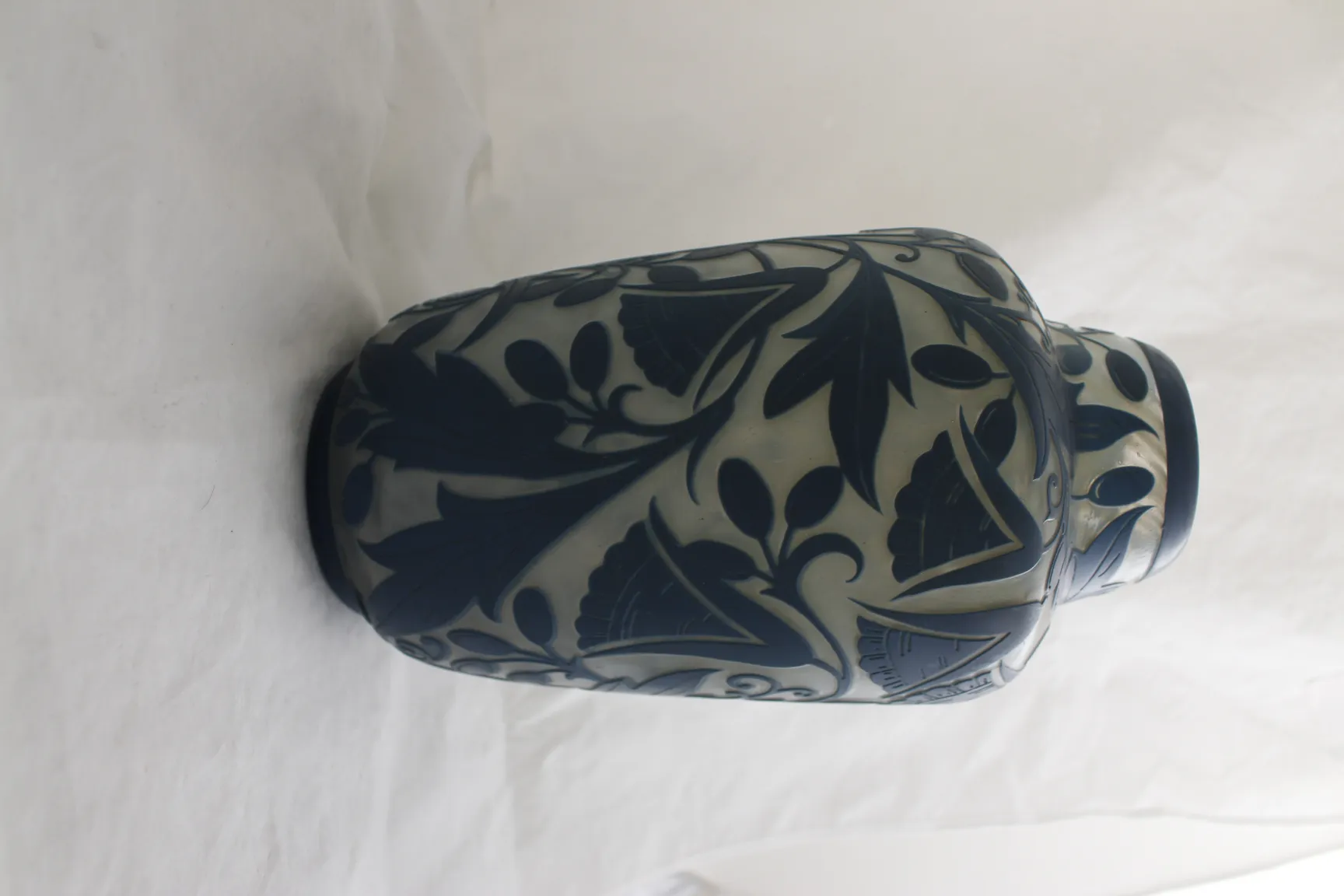 antique glass decorated with floral engravings in blue