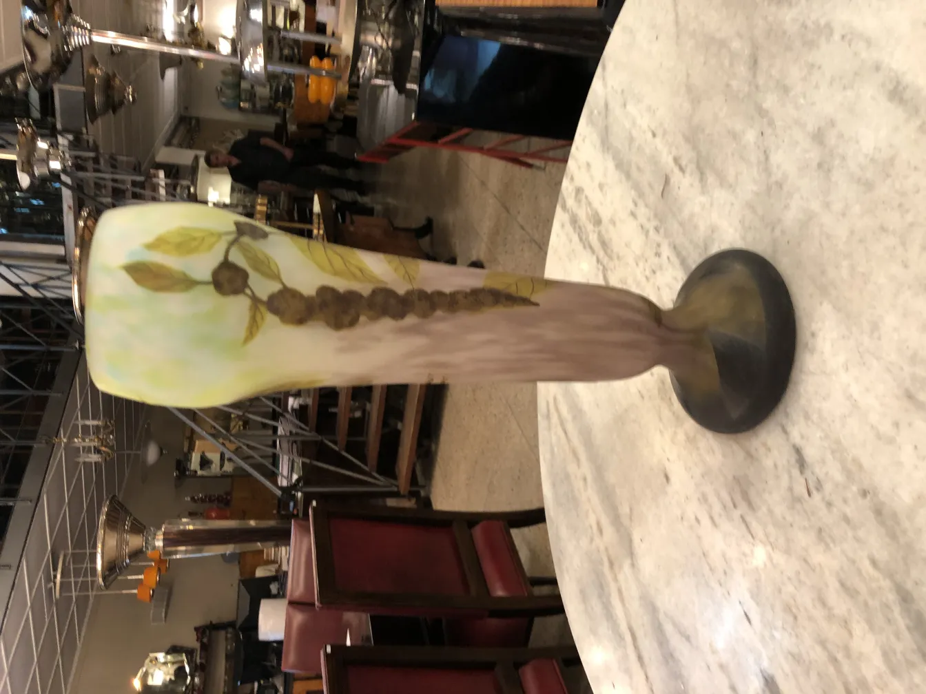 Antique vase signed Daum Nancy with a green leaf design.