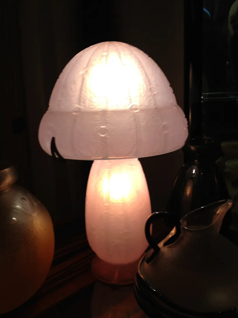 Signed glass lamp by Daum Nancy, mushroom-shaped with soft illumination.