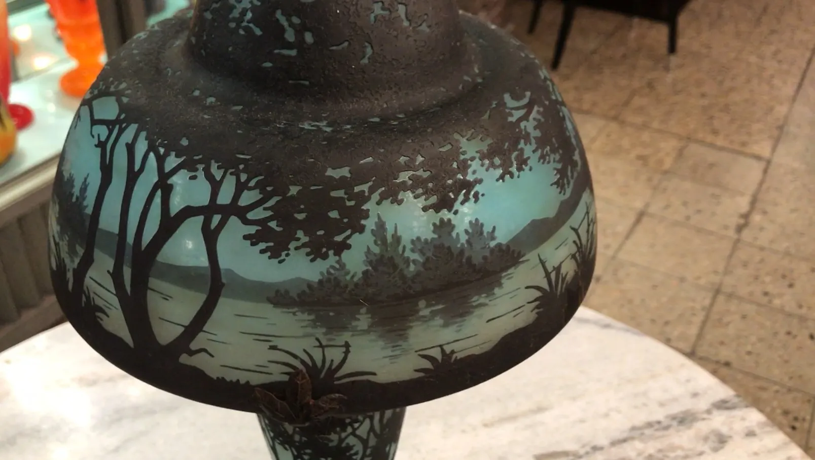 Signed glass from Daum Nancy featuring a painted landscape.