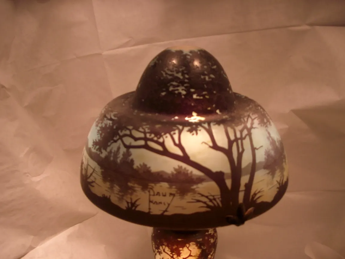 Antique signed glass Daum Nancy featuring tree landscapes