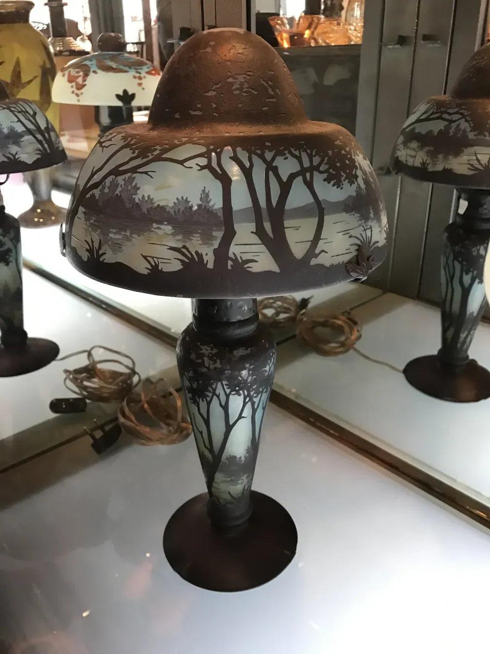 Signed glass Daum Nancy pedestal shape with landscapes.