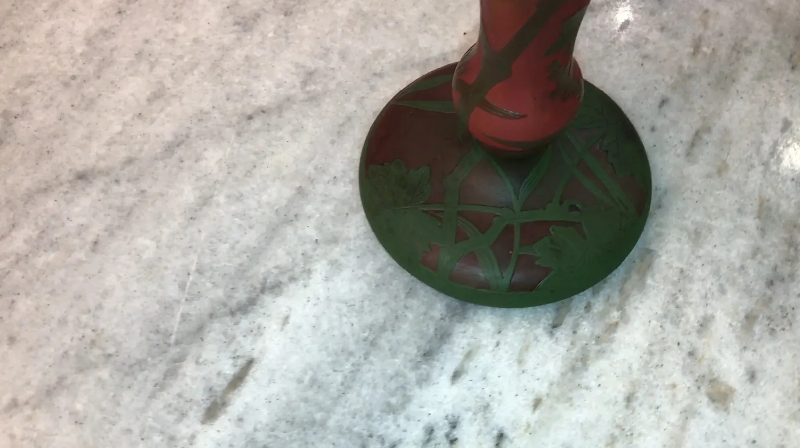 antique signed glass Daum Nancy with green details on red background