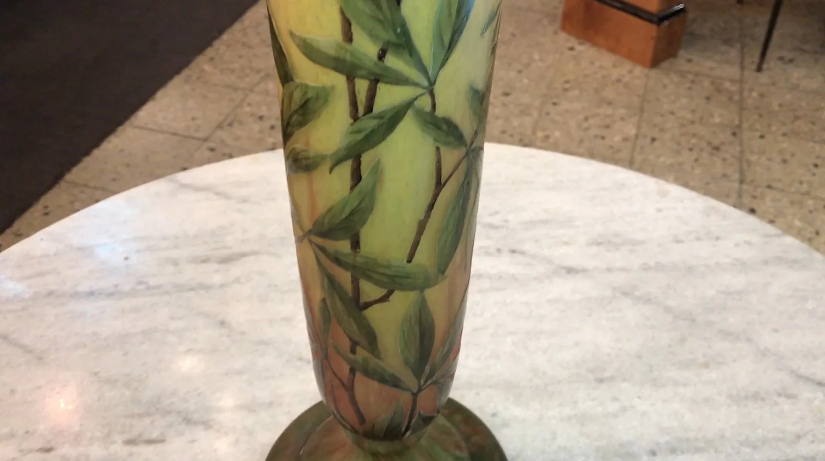 tall antique glass vase with leaf patterns