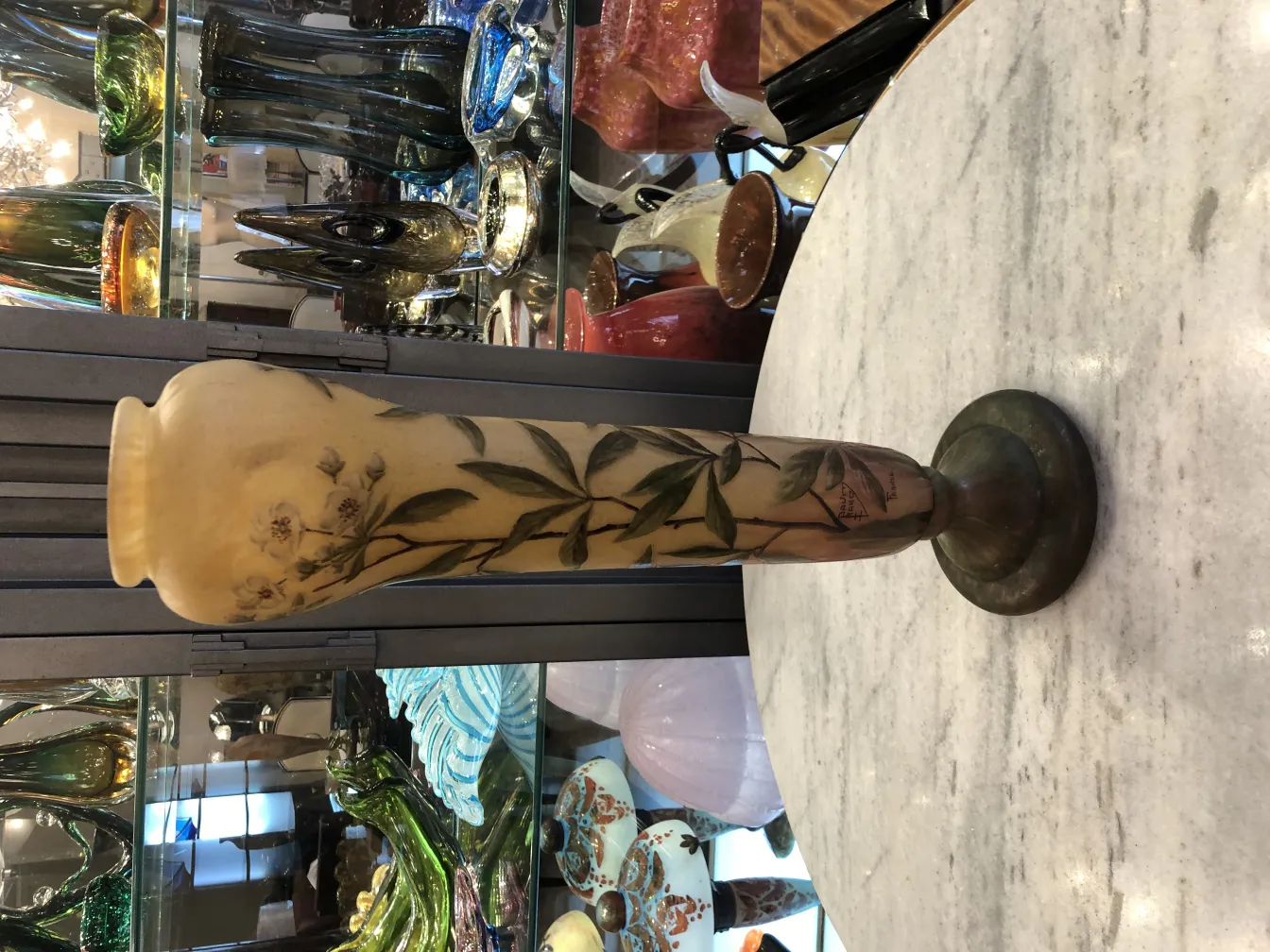 antique vase with flowers and signature, decorative setting