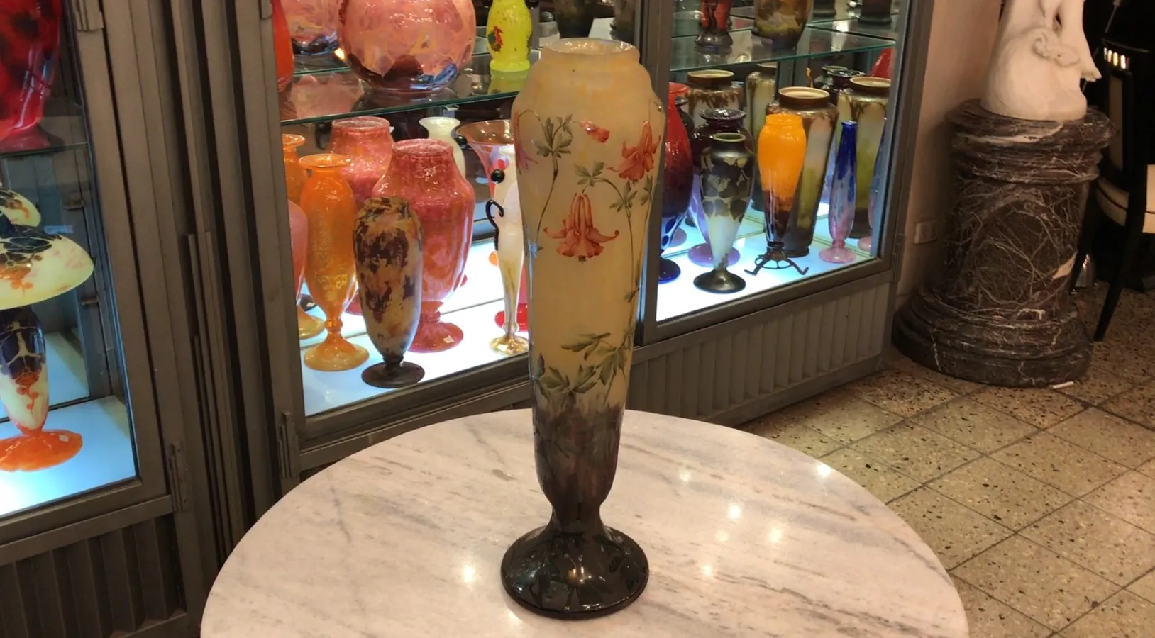 signed glass with floral patterns in an antique setting