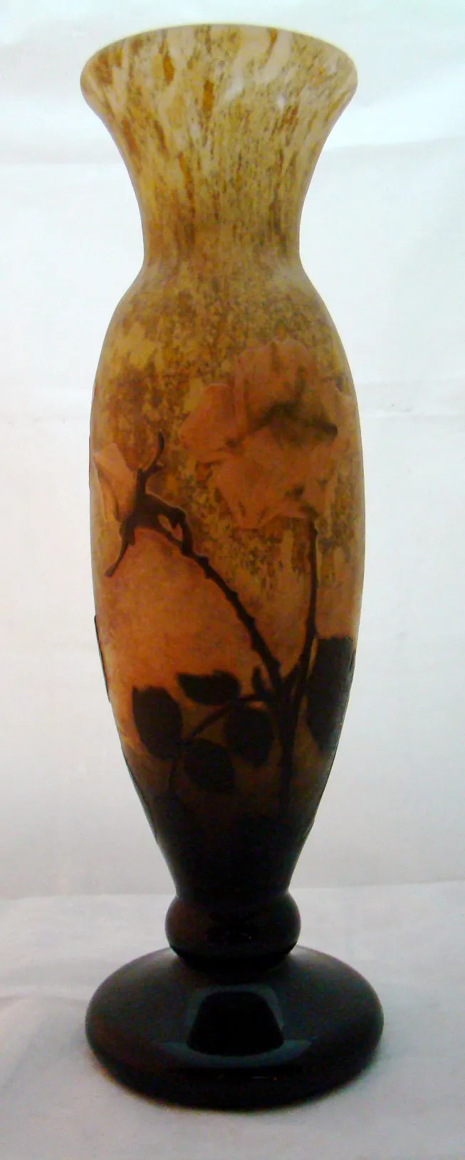 antique glass vase featuring floral design