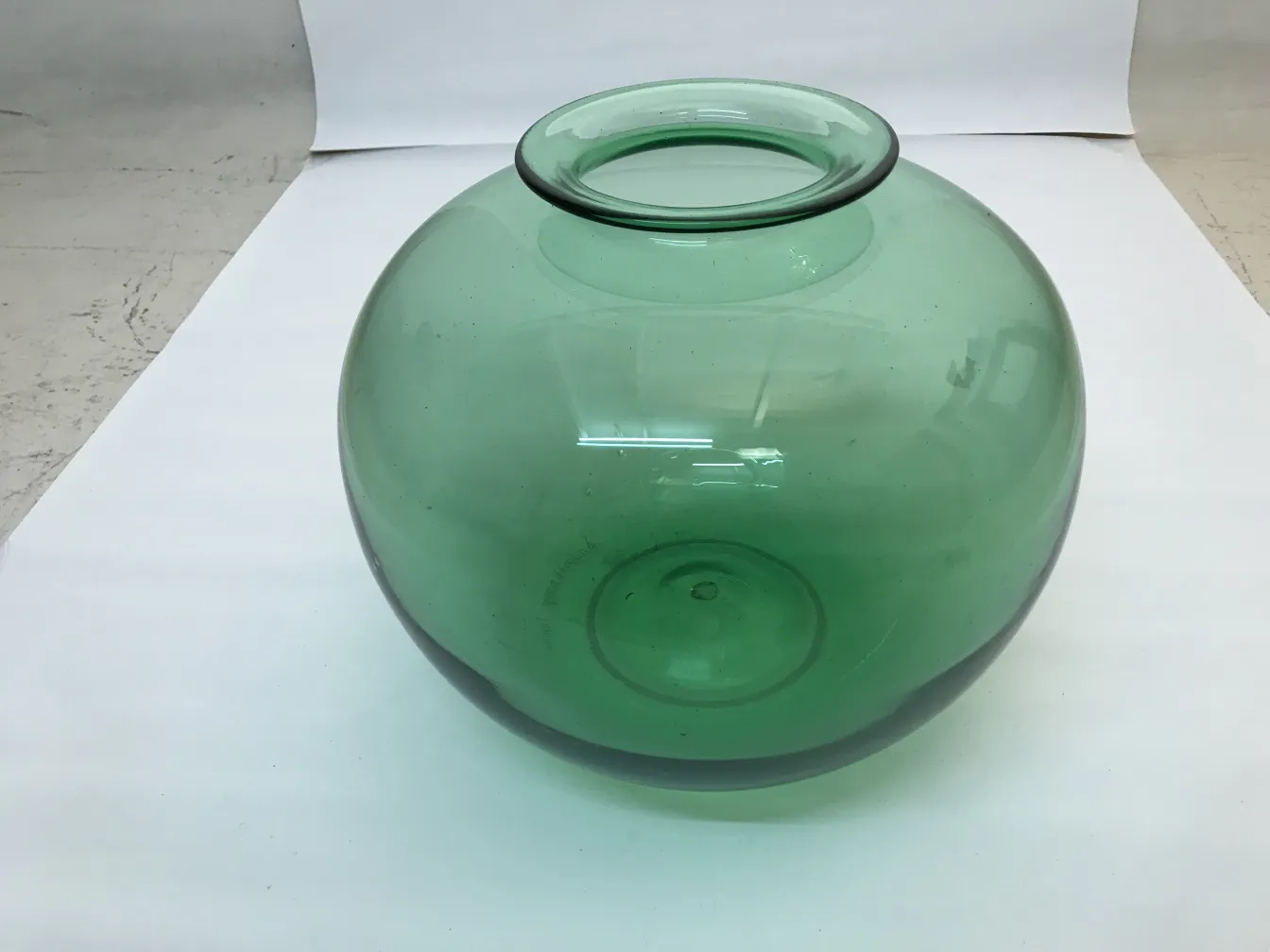 Antique signed glass in green, Daum Nancy, on a white background.