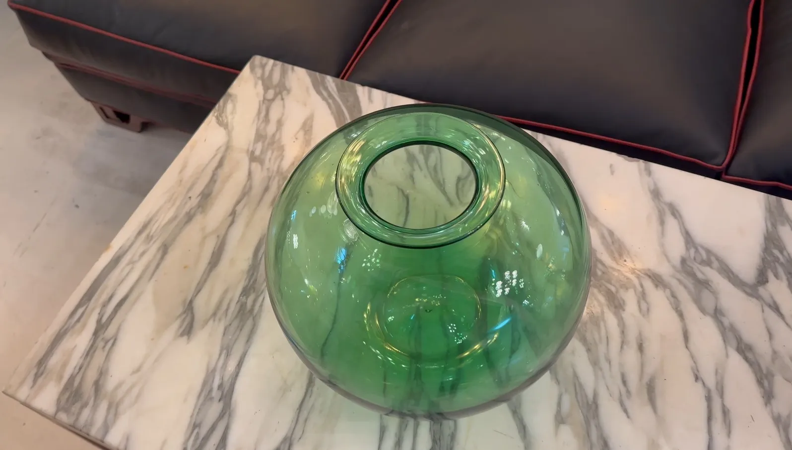 green round glass signed daum nancy on marble table