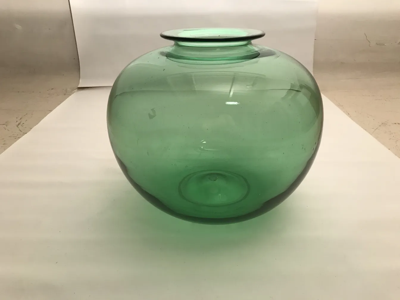 green antique glass jar from Daum Nancy with elegant round shape.