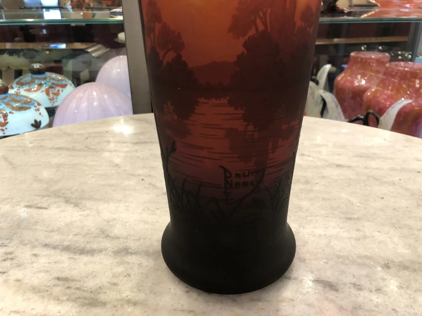 Antique glass featuring a landscape, signed Daum Nancy.