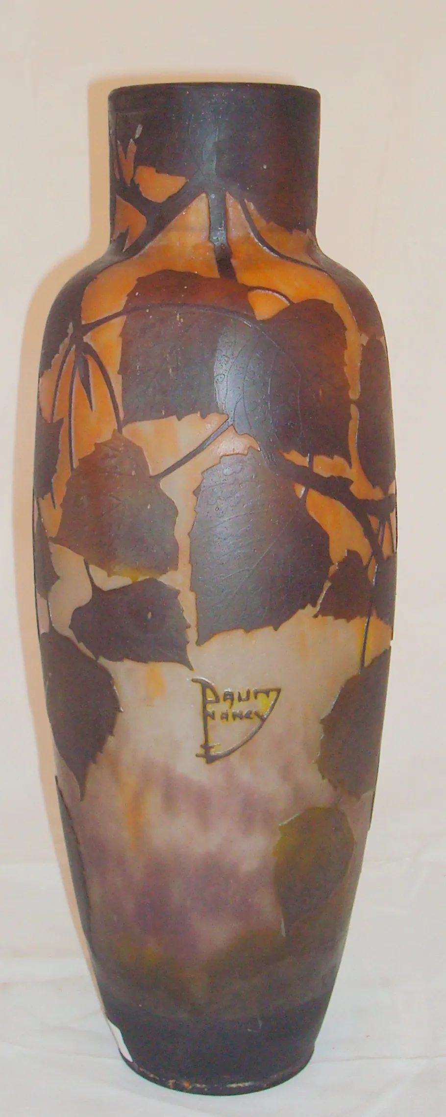 Signed glass Daum Nancy with dark leaf decorations