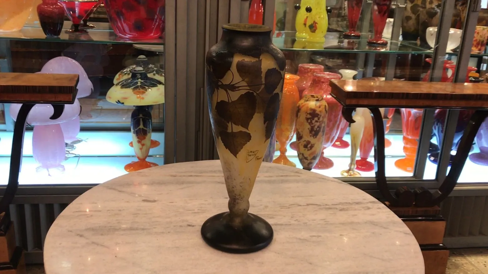 signed glass daum nancy featuring leaf designs on a light background