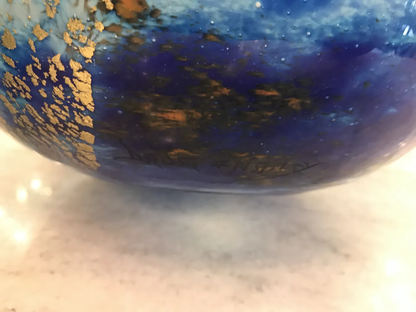 antique glass piece with golden details and signature