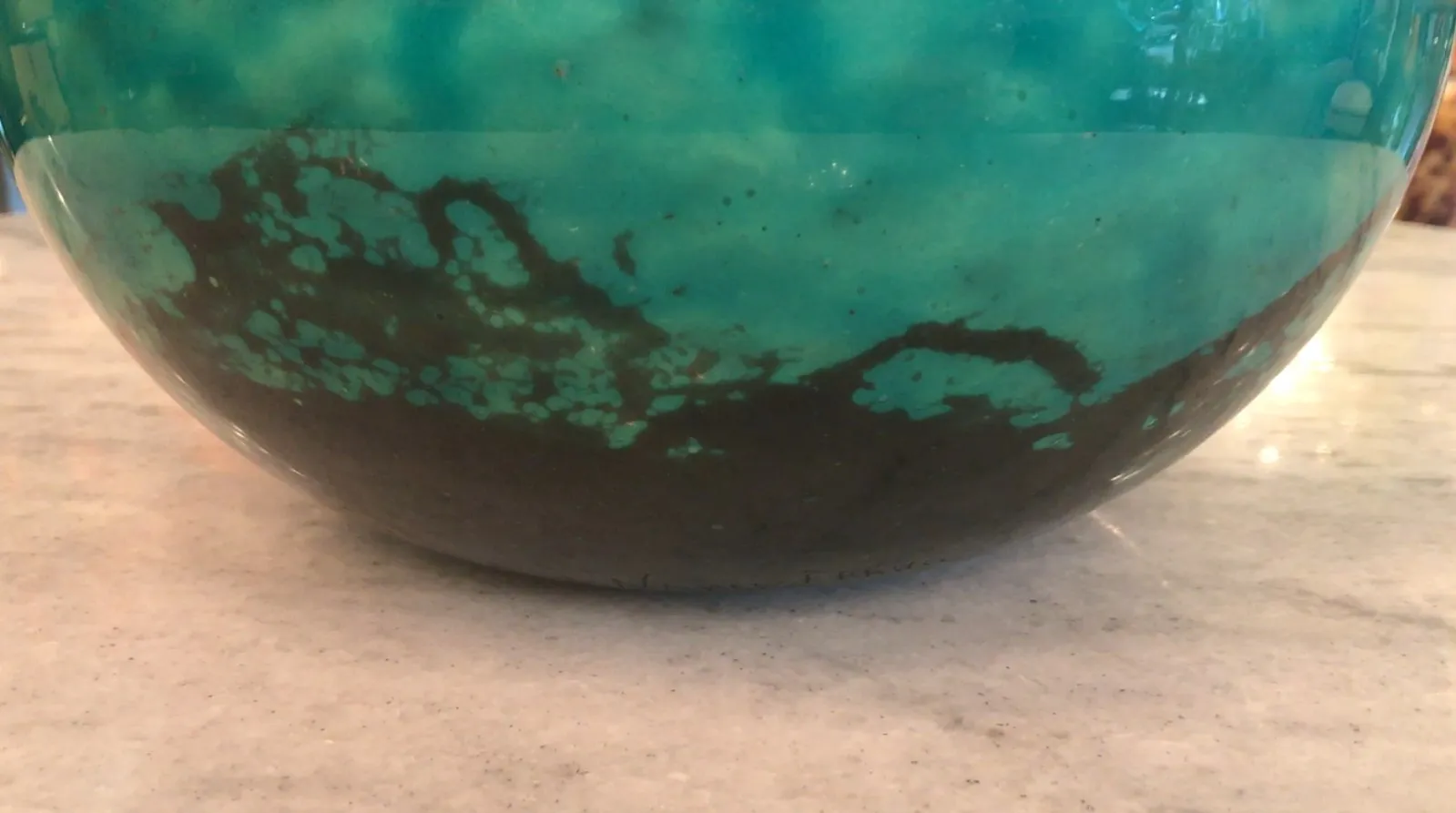 Antique signed glass Daum Nancy in shades of blue and black with speckled texture.