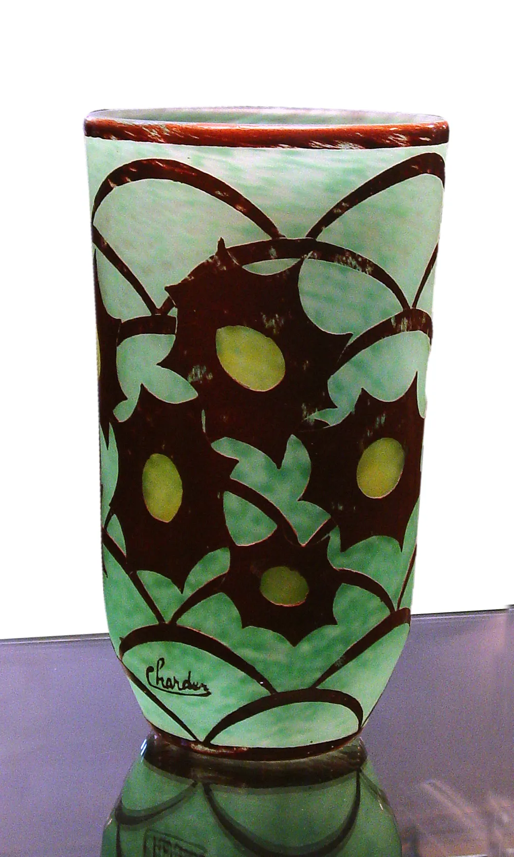 Vidro antigo assinado por Charder com design floral.