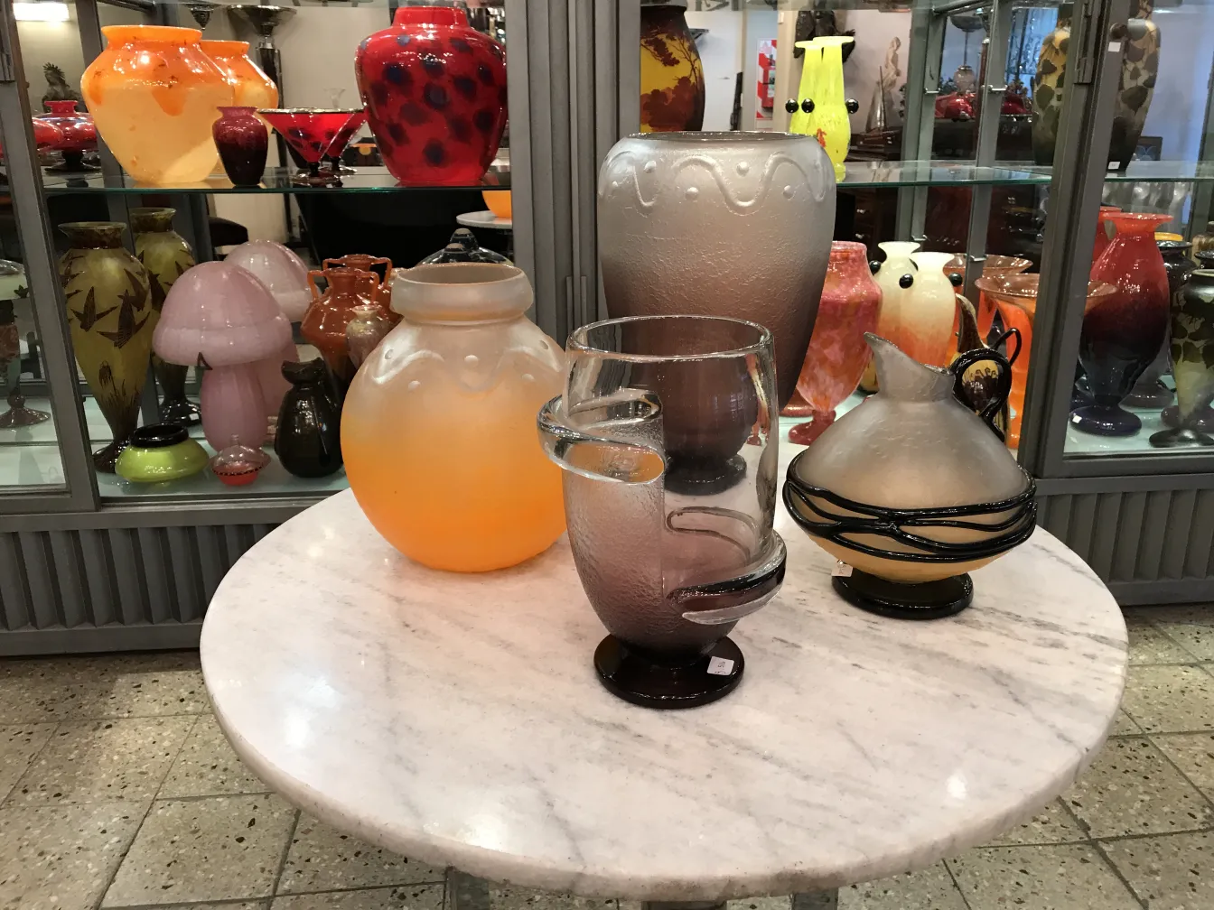 Antique signed glass by Charder in an antique setting