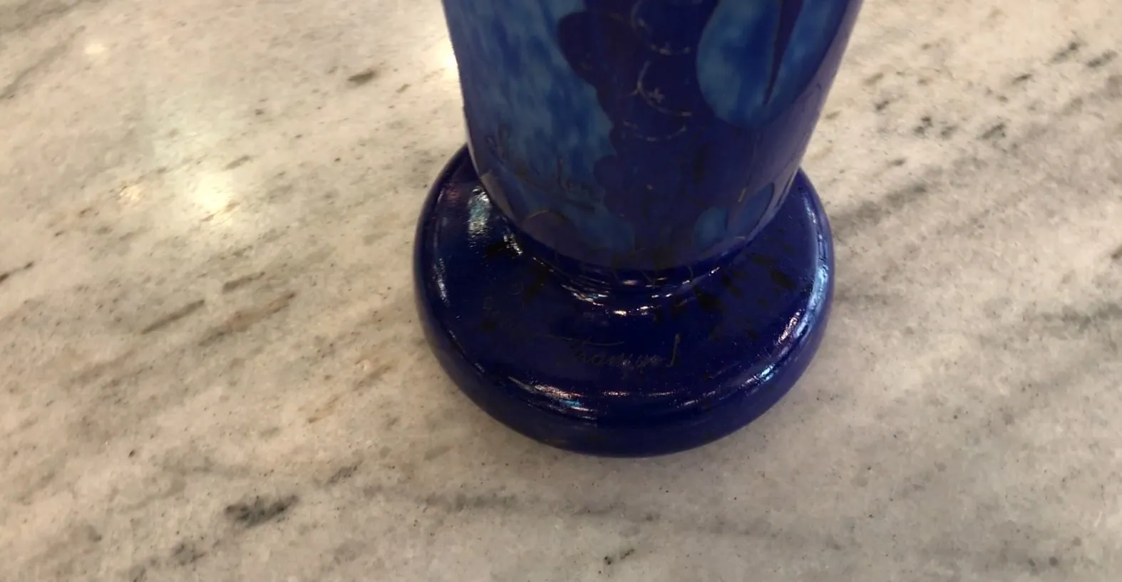 Antique signed glass by Charder in blue color, round base on marble.