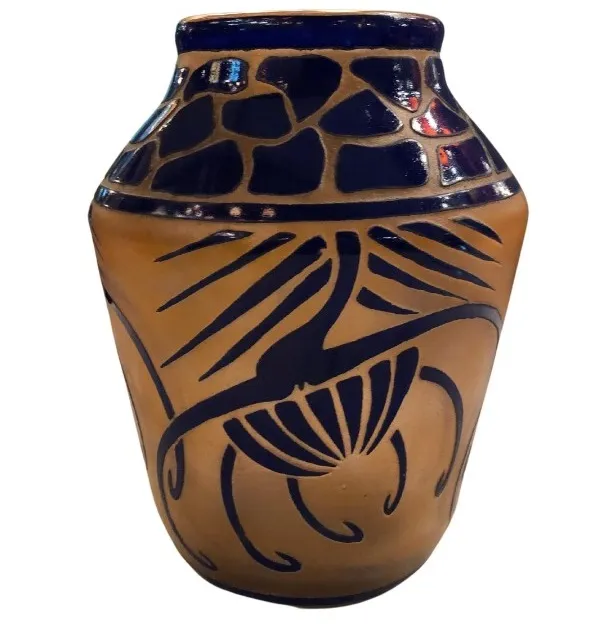 antique glass jar with raised design and vibrant colors