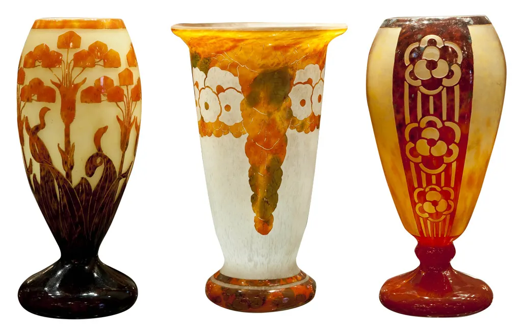 Three elegant antique vases with varied decorative designs.