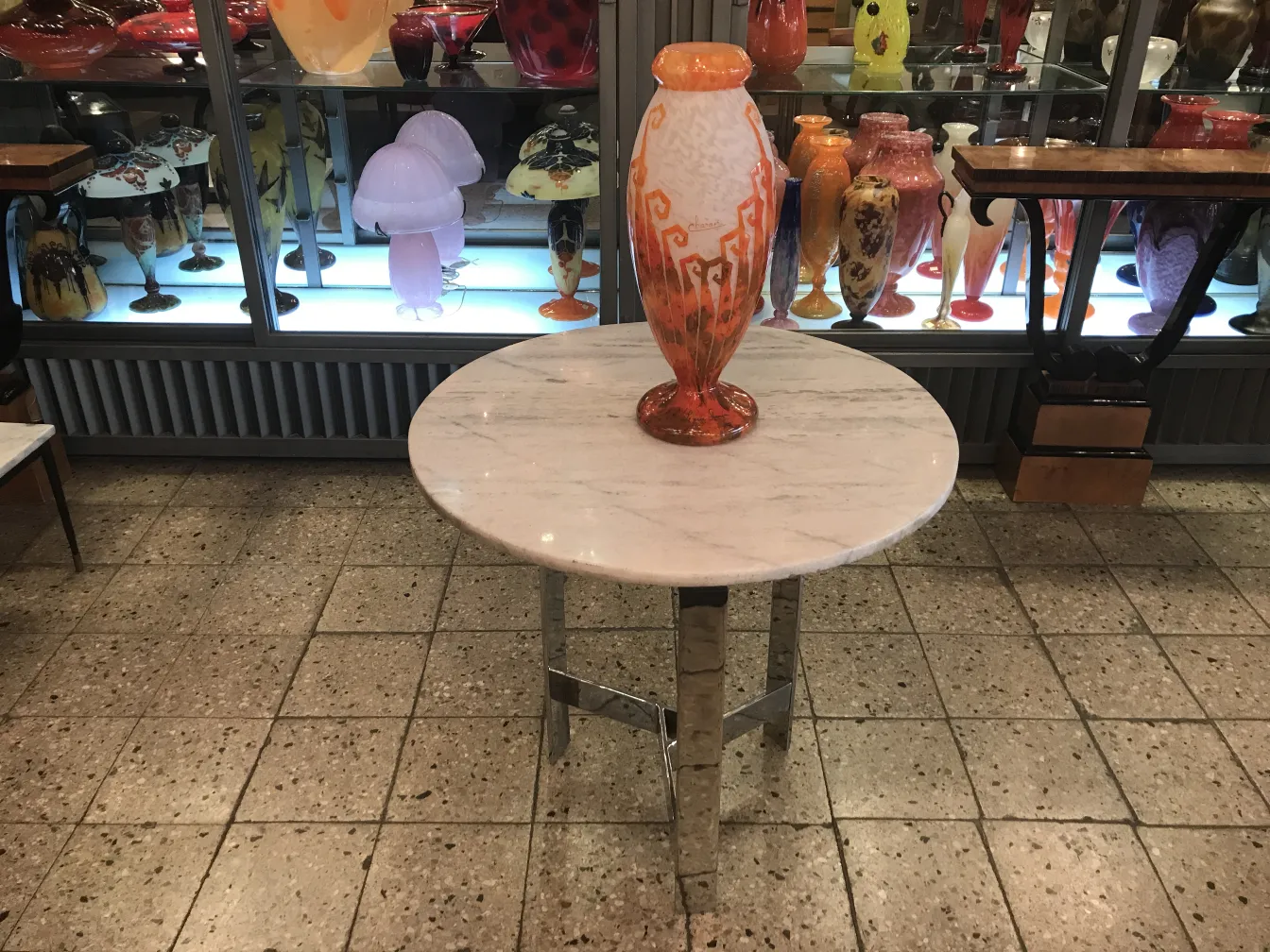 Signed Glass Charder on an oval table with decorations