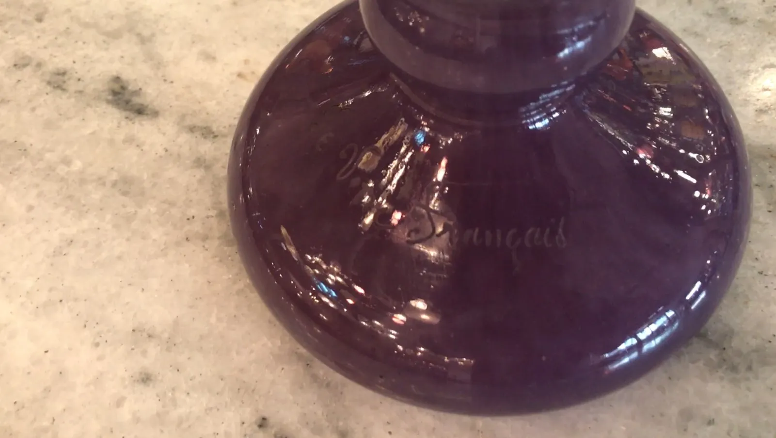 Antique signed glass by Charder with a shiny surface.