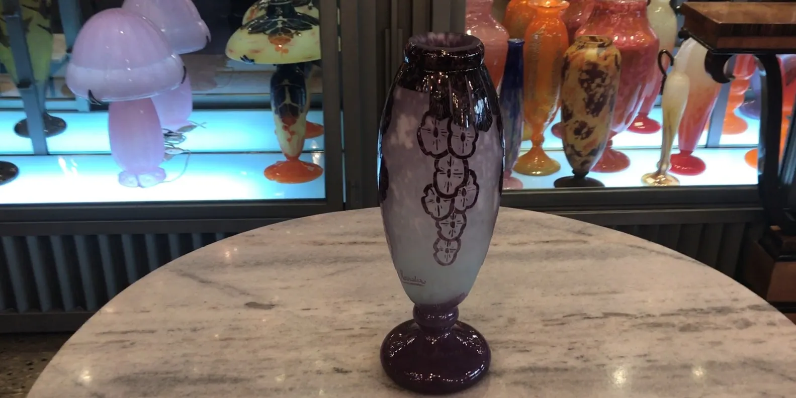 Antique signed glass by Charder with artistic details.