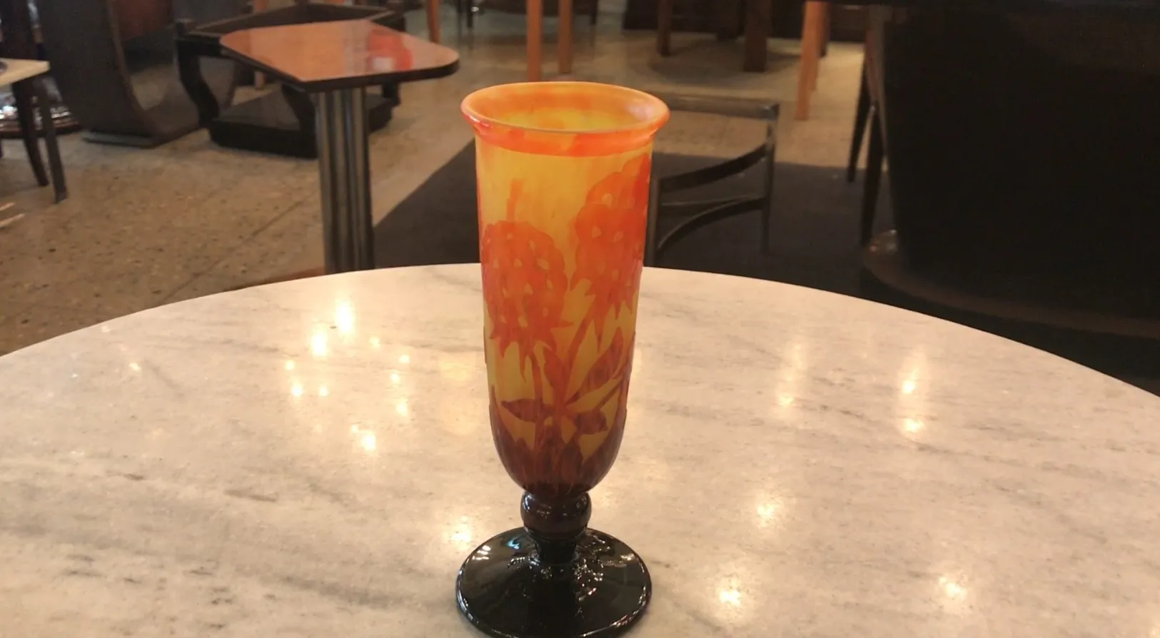 SIGNED GLASS Charder with vibrant colors in background