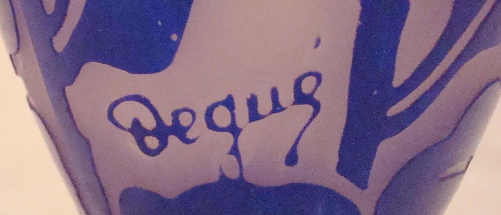 elegant antique glass with Degué signature in the center