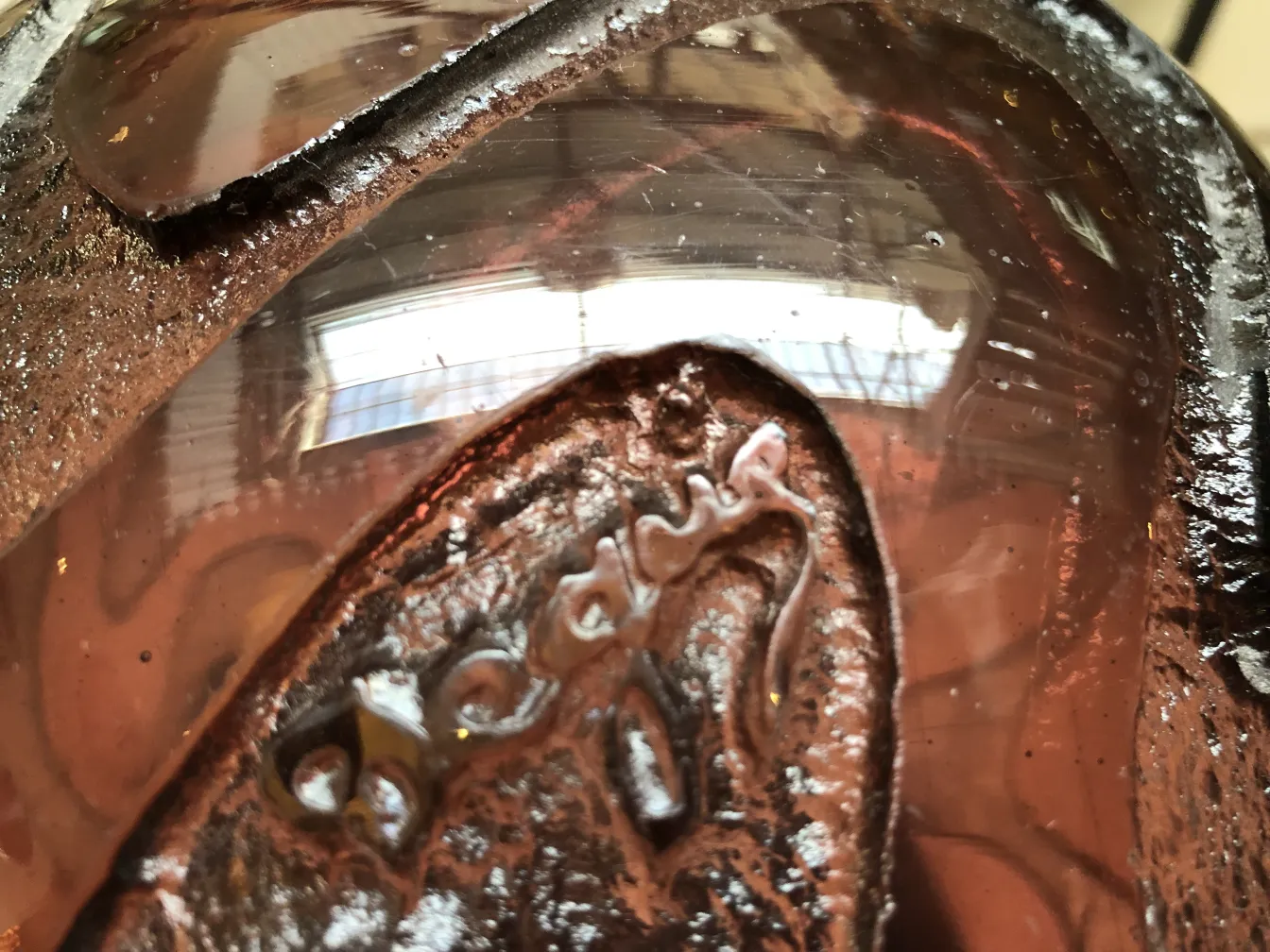 Antique signed glass Degué with visible details in the ambiance