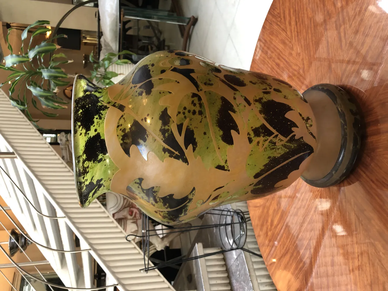 antique signed glass degué with green leaf decoration in an elegant setting