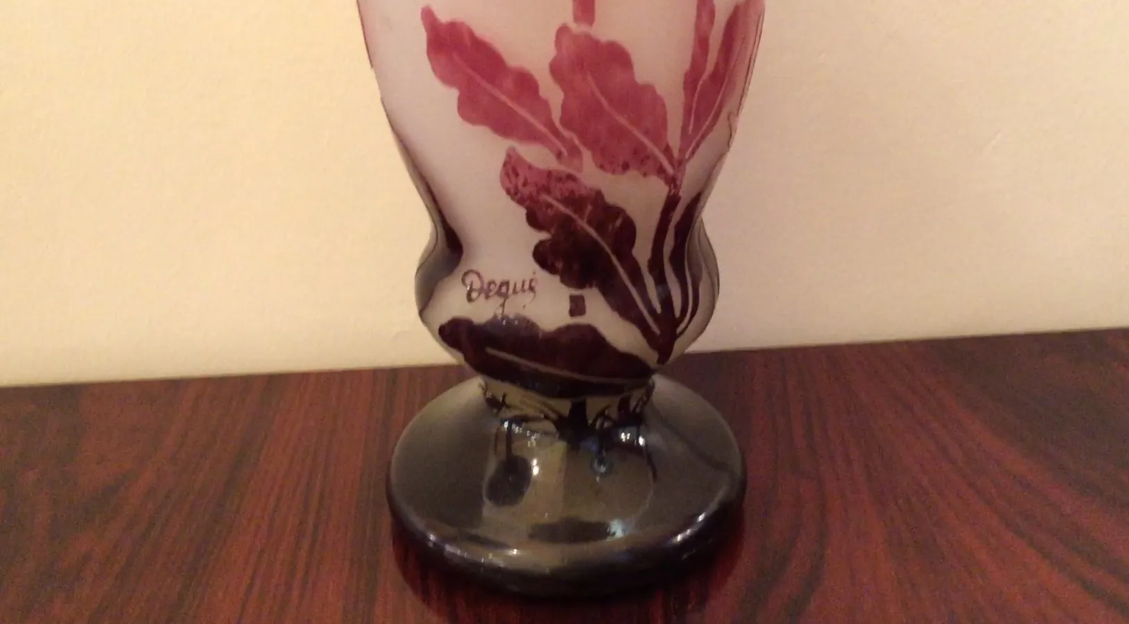 Antique signed glass Degué with floral design, dark base.