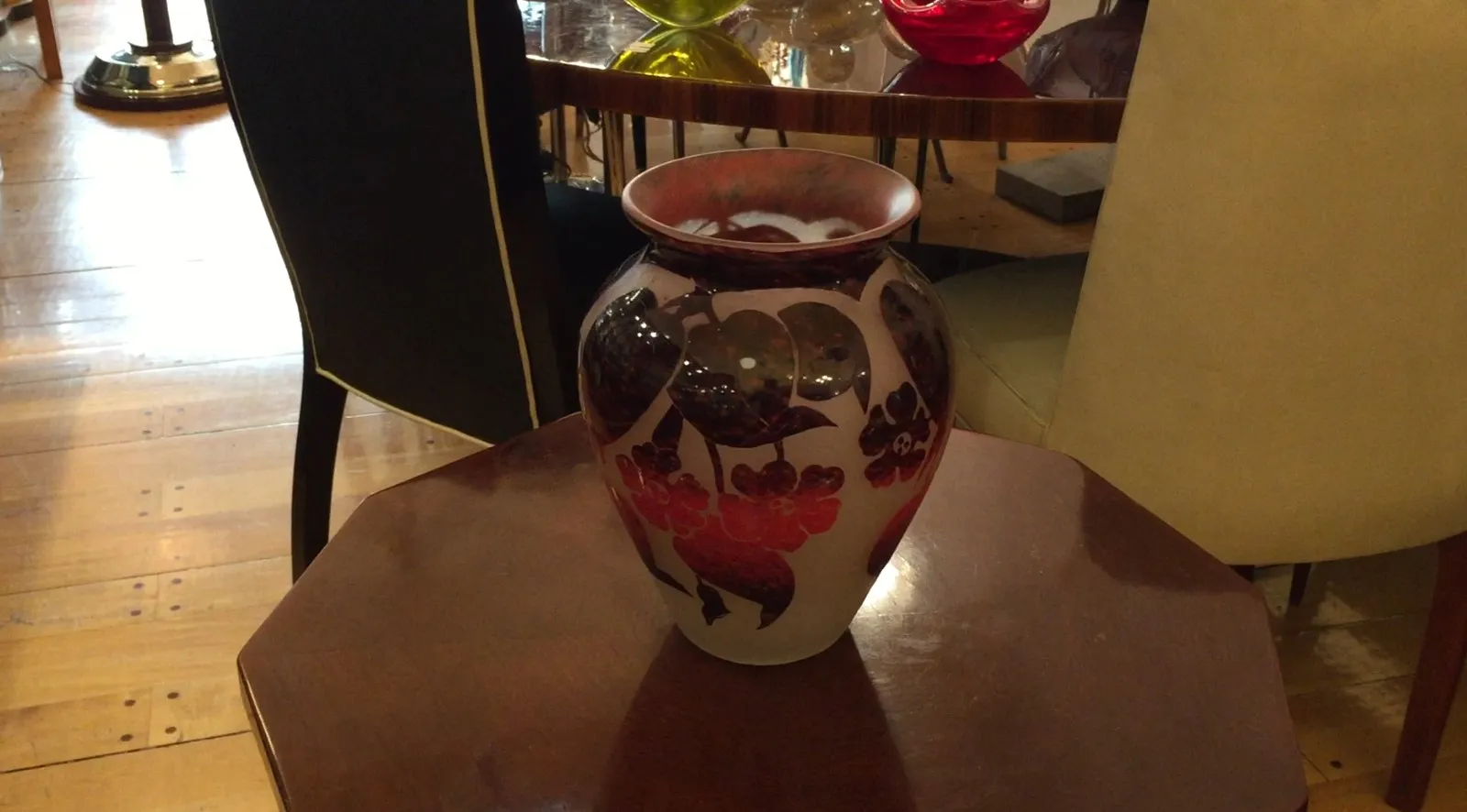 antique signed glass vase by degué with floral design on table