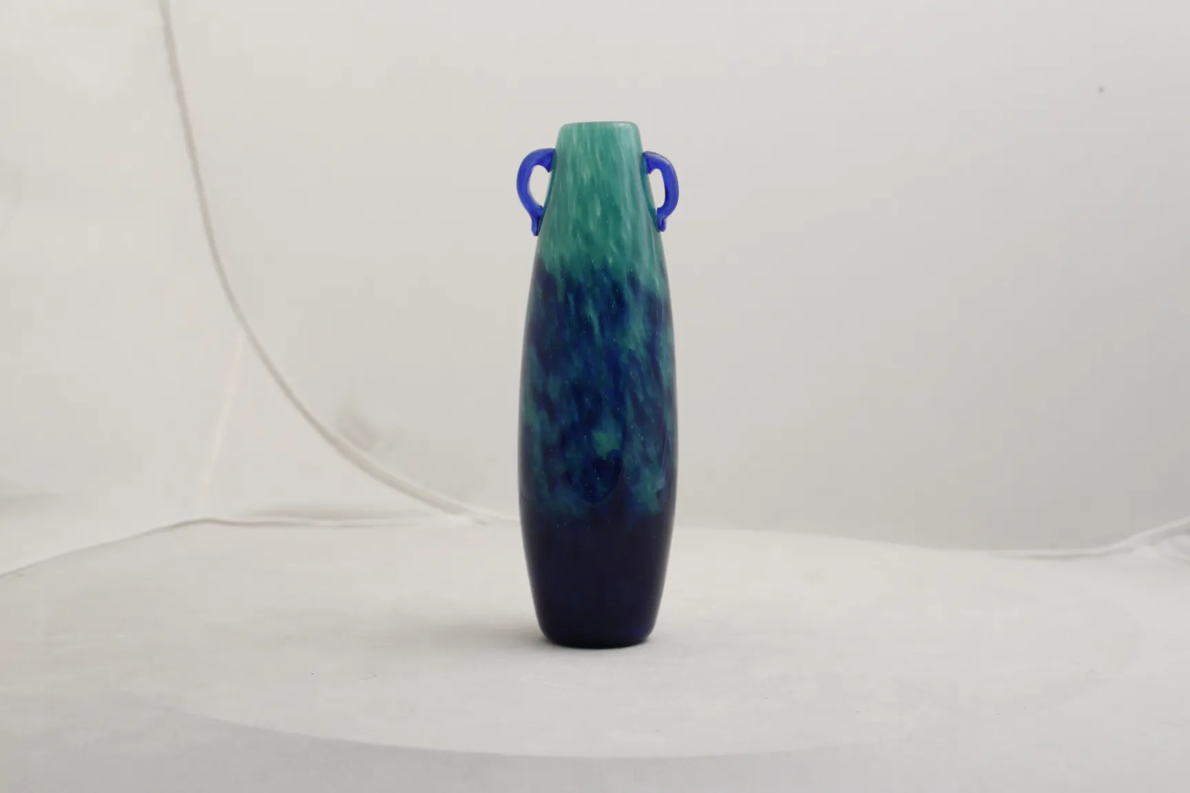Antique signed glass vase by Degué in blue and green tones.