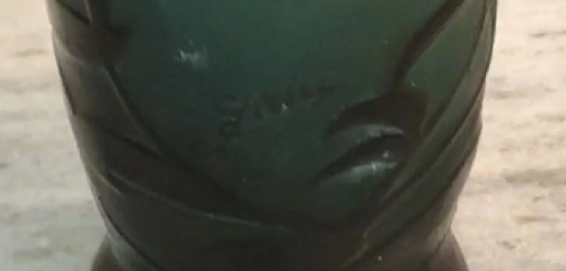 Signed Gallé glass featuring unique details and antique surroundings.