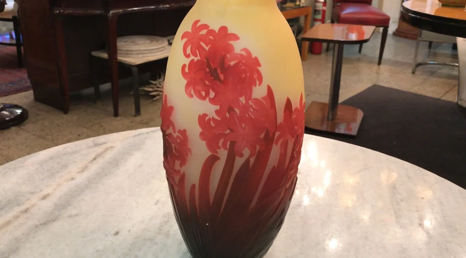 Antique vase with red floral design, decorative.