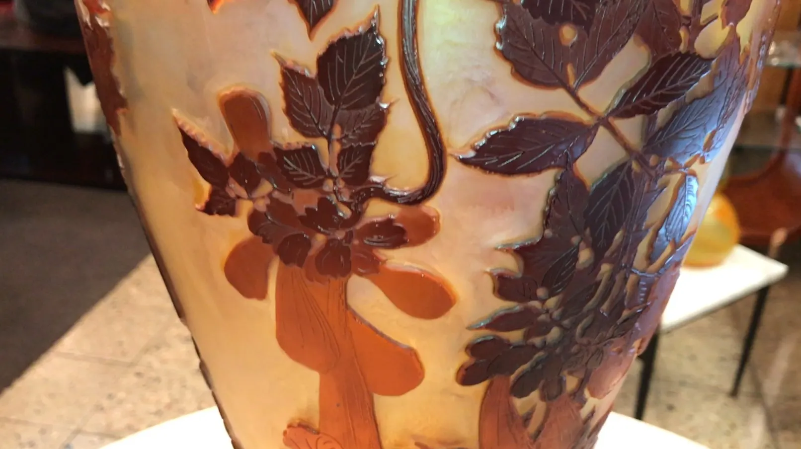 SIGNED GLASS Gallé with raised details of leaves and flowers on a warm background