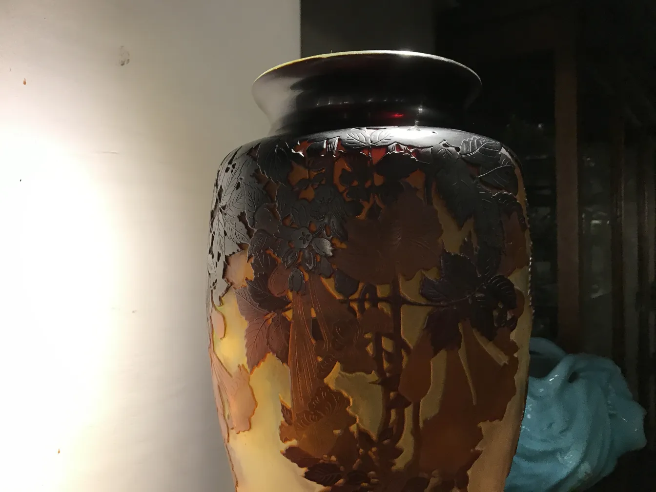 Vase with gallé signature and decorative details in an antique setting