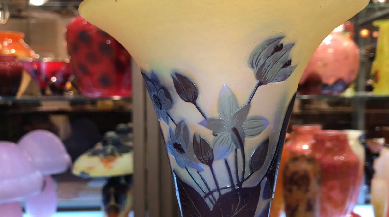 Antique vase featuring carved flowers and a soft background, Gallé