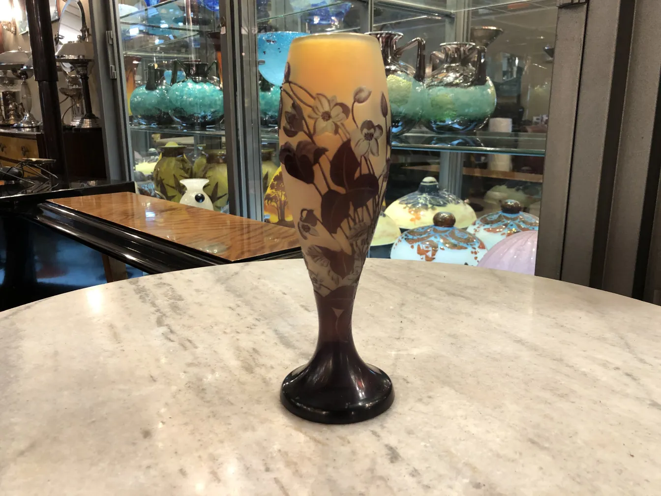 signed glass gallé with floral design, antique setting