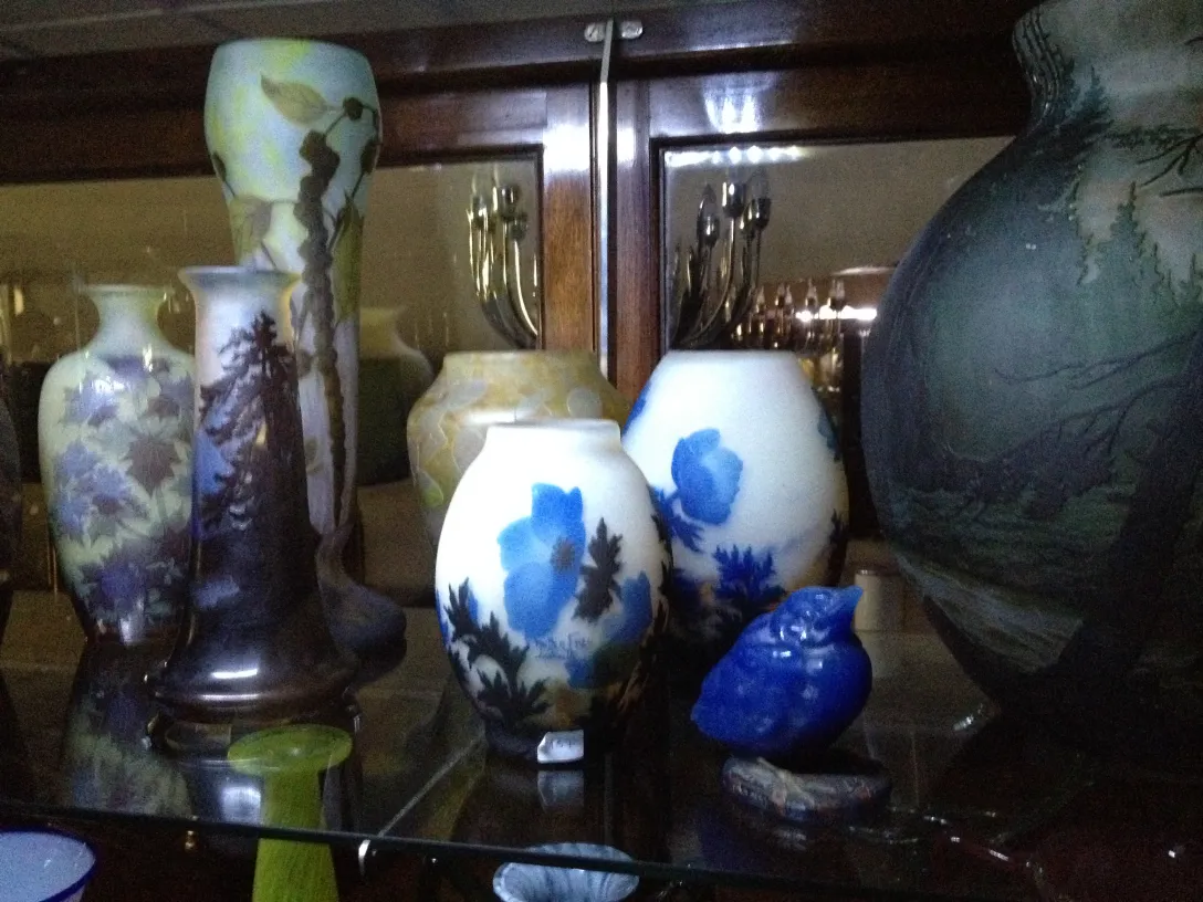 Vases of signed glass Gallé showcased, soft colors