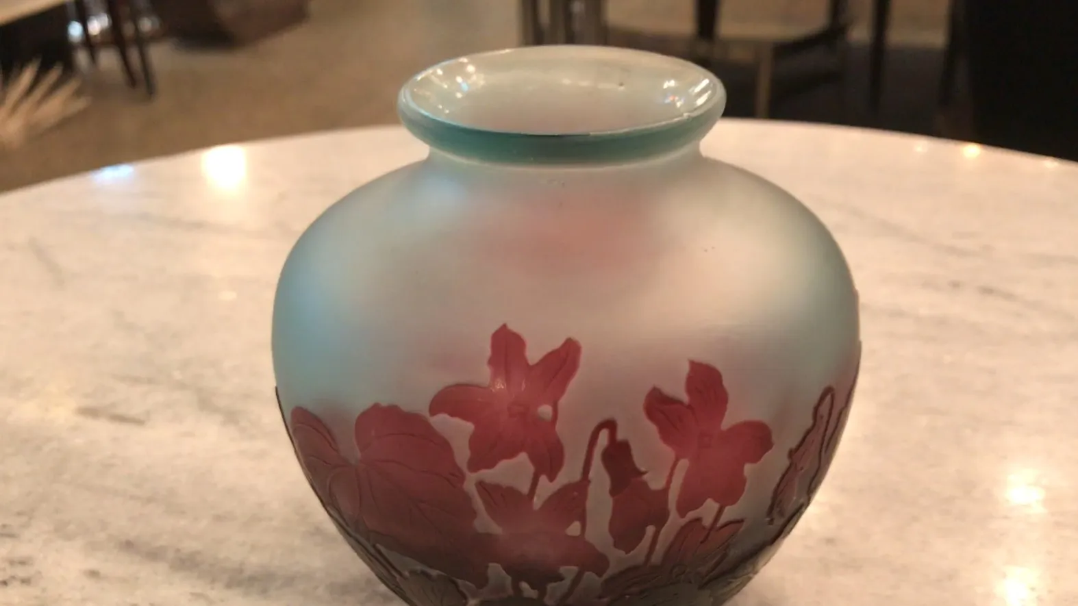 signed glass gallé featuring floral design