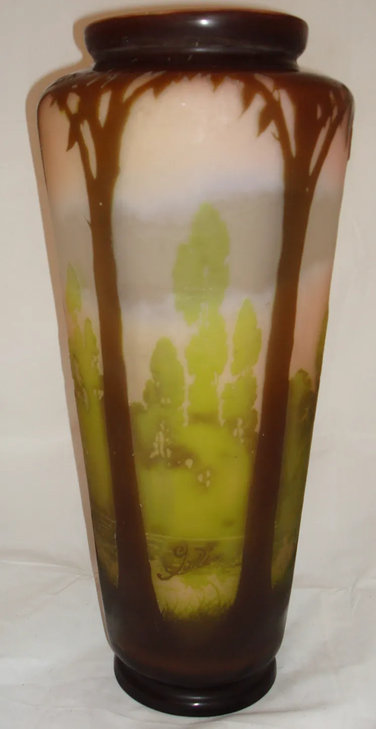 antique vase of signed glass Gallé featuring a landscape of trees and nature in soft tones