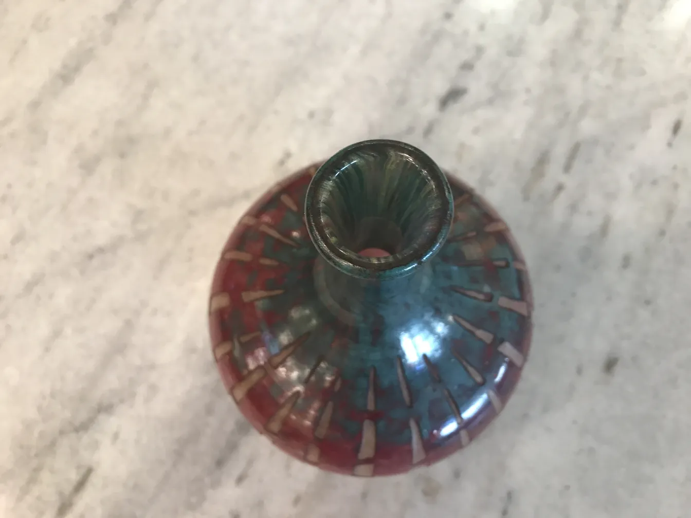 Top view of an antique signed glass with candy and french flag design
