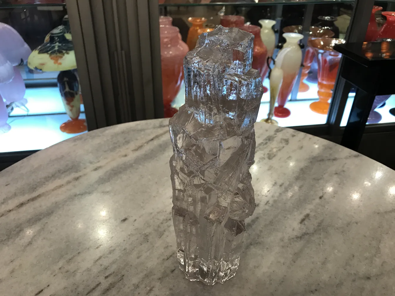 Signed glass with interesting design on marble table.