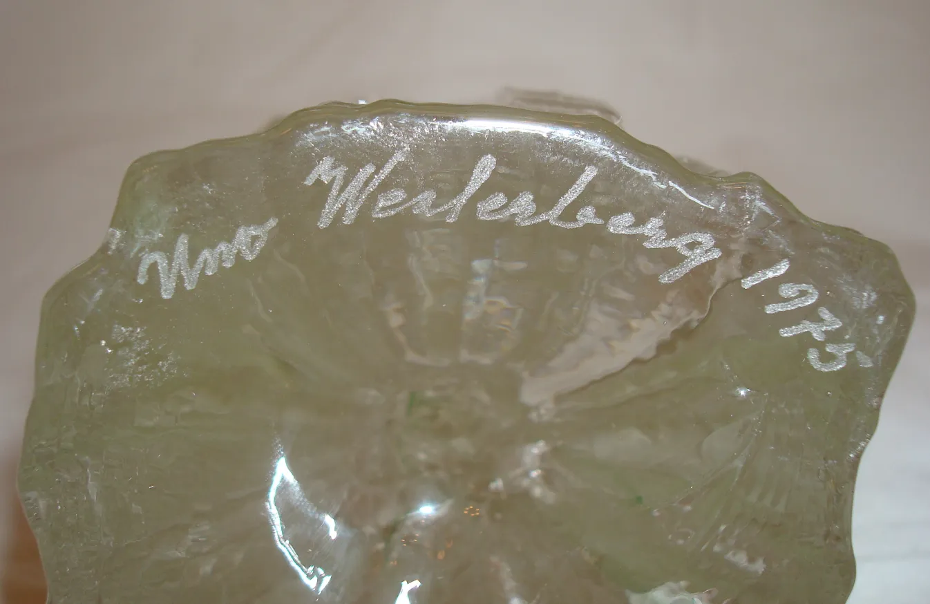 Signed glass with decorative inscriptions in irregular shape