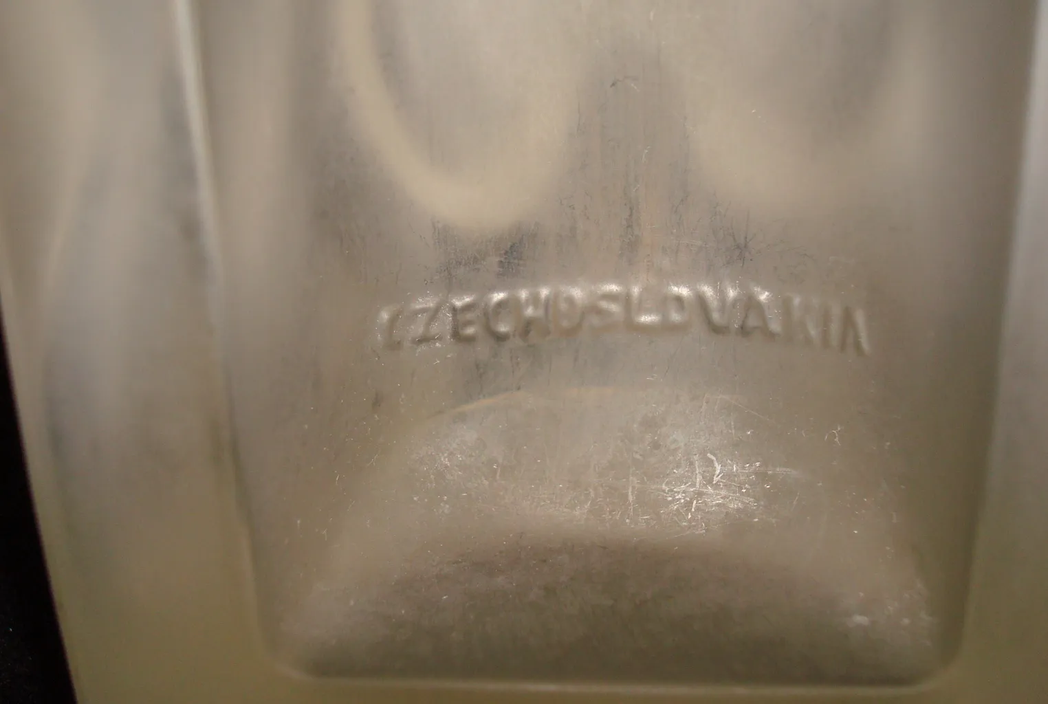Antique signed glass with visible inscriptions on the bottom.