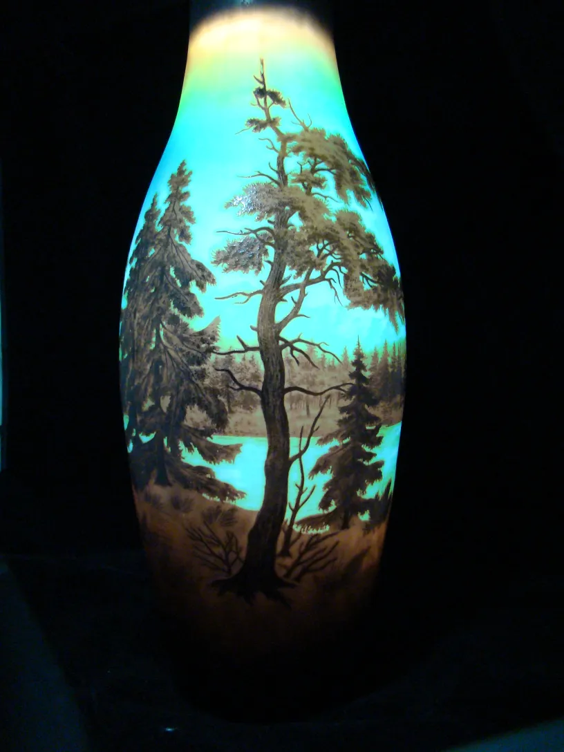 Signed D'Argental glass featuring a treed landscape on the top.