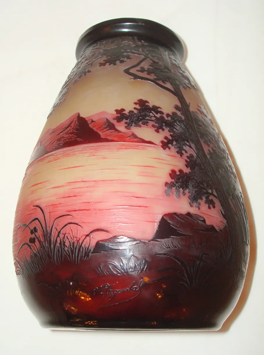 antique signed glass D'Argental featuring a reddish landscape