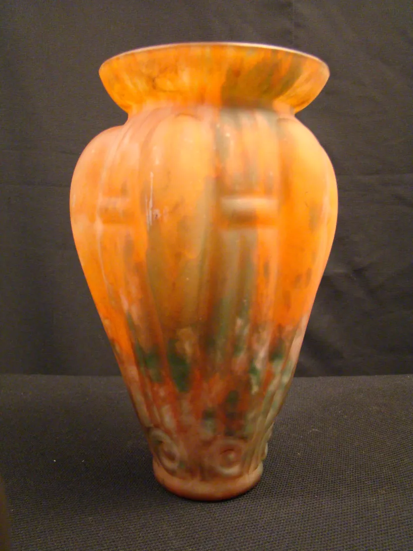 Antique glass vase, orange color with green details
